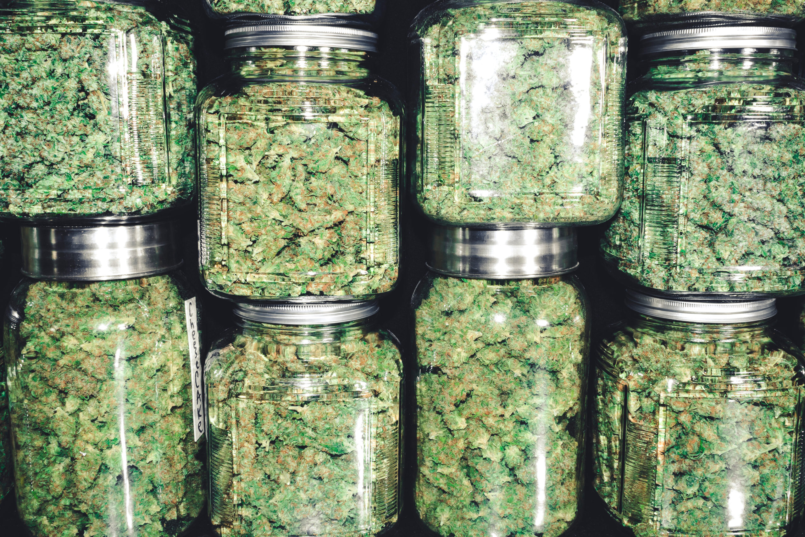 Marijuana,Buds,In,Glass,Jar,Stack